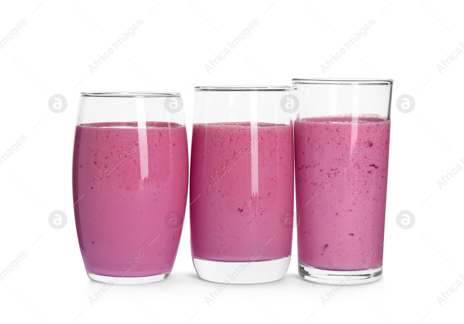Photo of Glasses of blackberry smoothie on white background