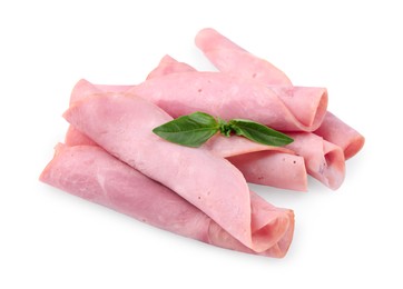 Photo of Rolled slices of tasty ham and basil isolated on white