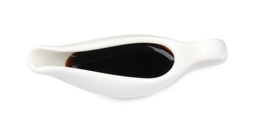 Tasty soy sauce in gravy boat isolated on white, top view