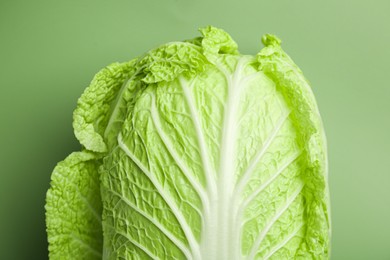 Photo of Fresh ripe Chinese cabbage on pale green background, top view