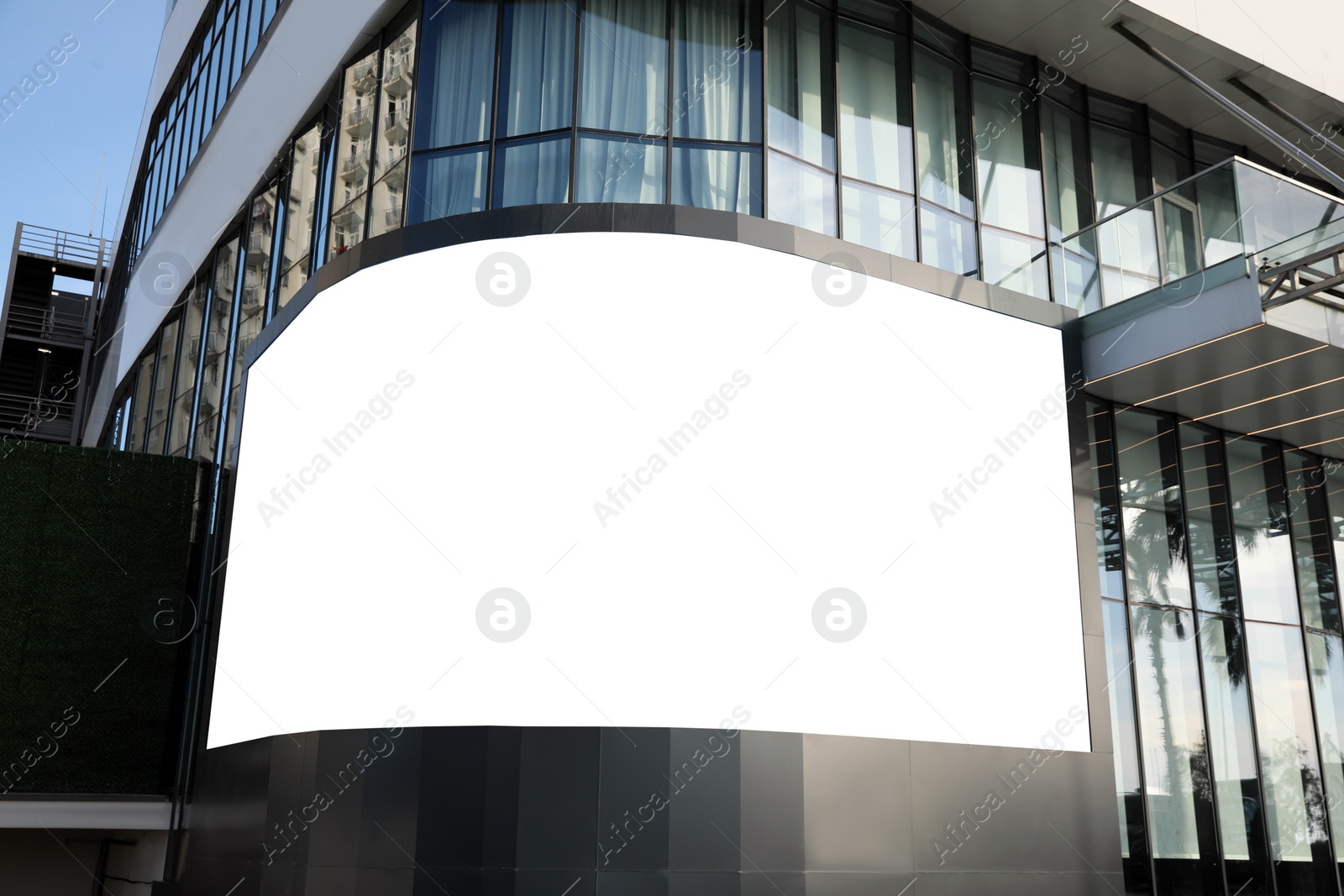 Image of Empty digital billboard on building in city. Mock-up for design