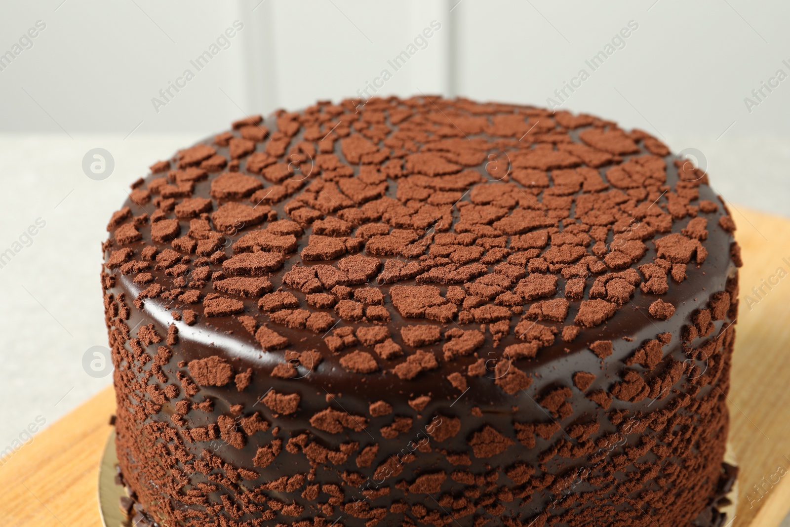 Photo of Delicious chocolate truffle cake on table, closeup