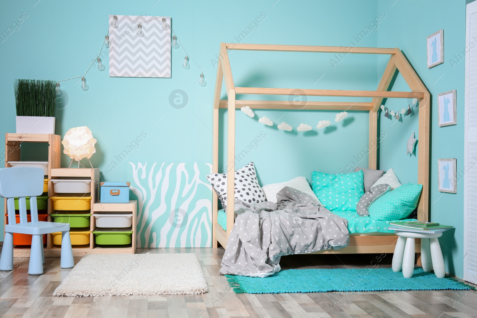 Photo of Comfortable bed in modern children room