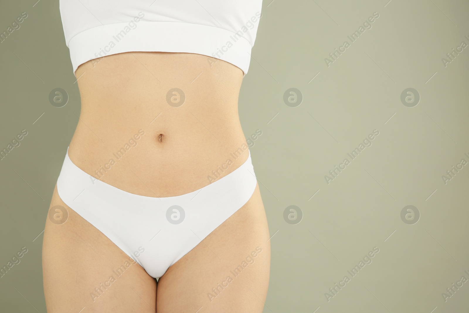 Photo of Gynecology. Woman in underwear on grey background, closeup. Space for text