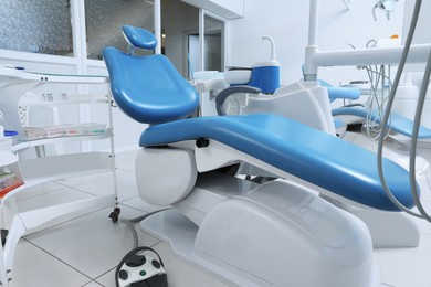 Dentist's office interior with chair and modern equipment