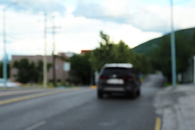 Photo of Blurred view of car on asphalt highway outdoors