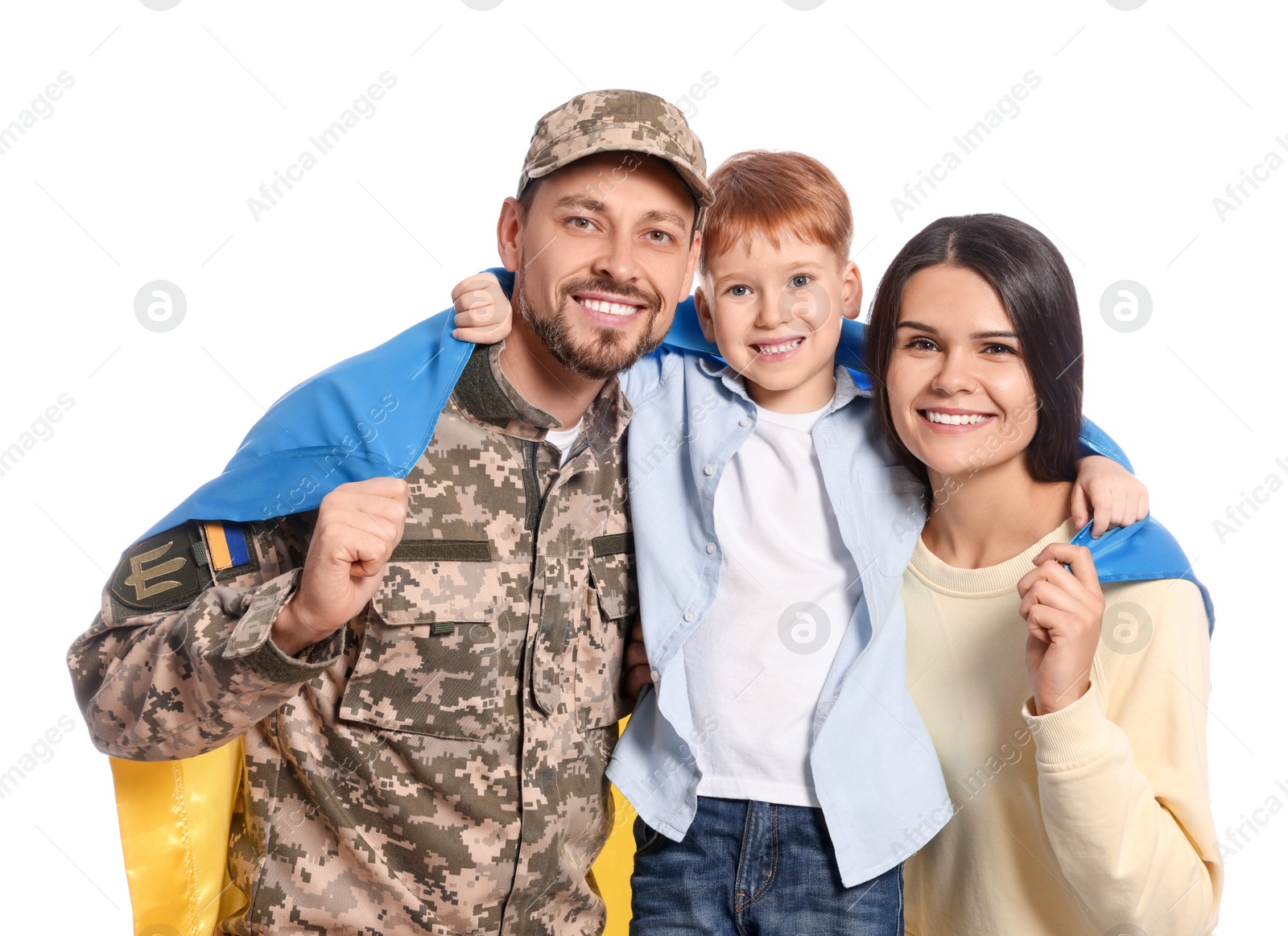 Photo of Ukrainian defender in military uniform and his family with flag on white background