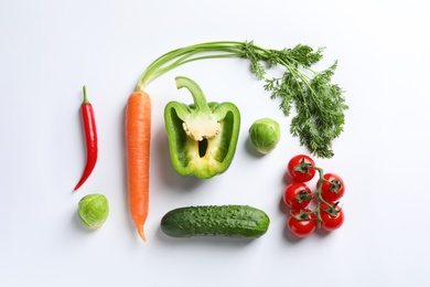 Photo of Fresh vegetables on white background, top view