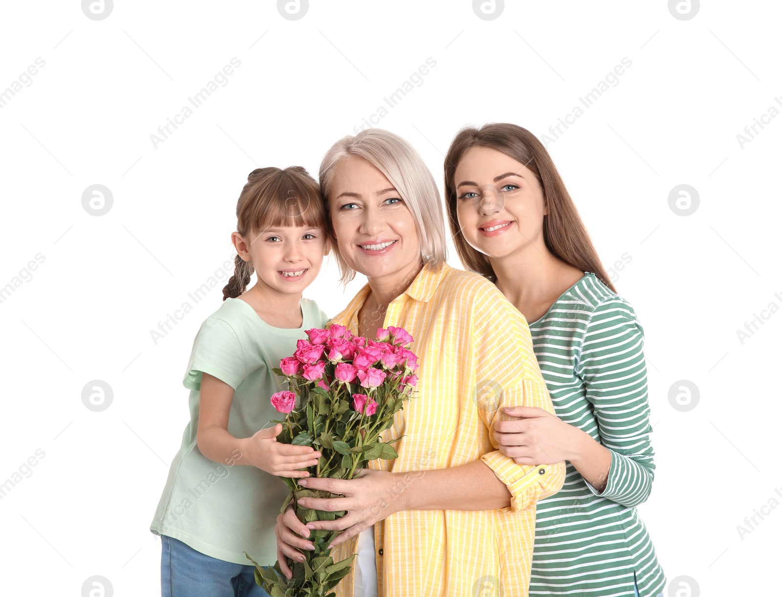 Photo of Beautiful mature lady, daughter and grandchild with flowers on white background. Happy Women's Day