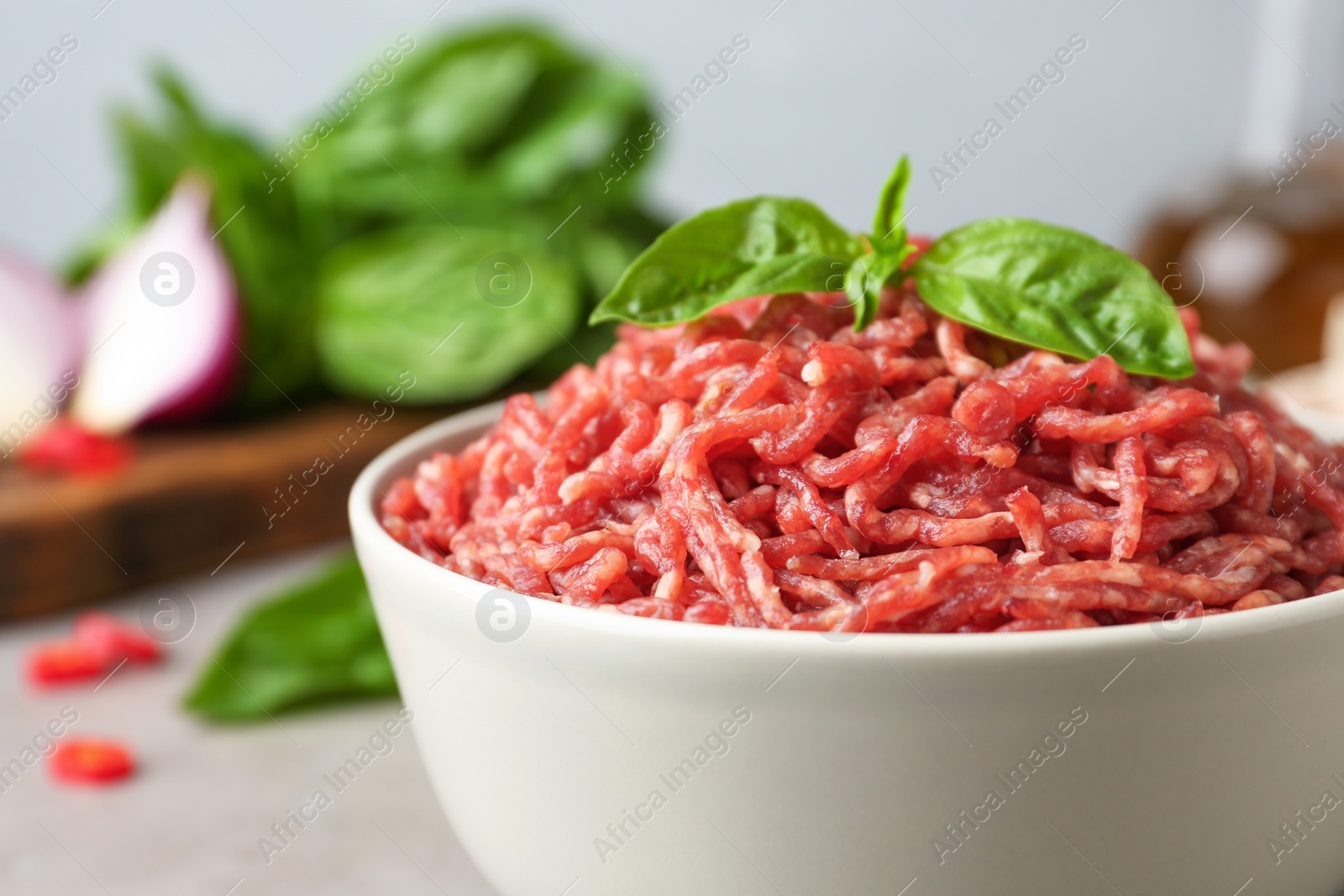 Photo of Fresh raw minced meat on light table, closeup