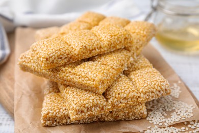 Photo of Delicious sesame kozinaki bars on table, closeup