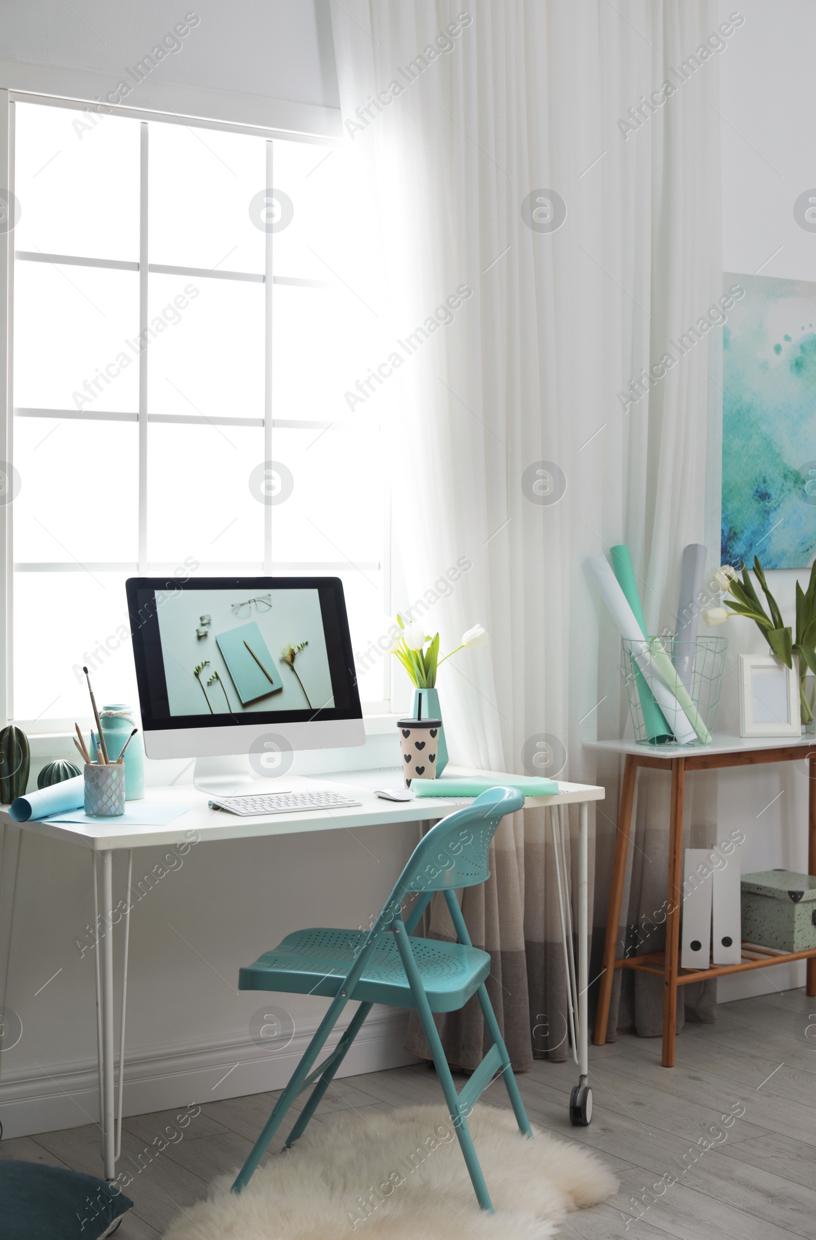 Photo of Stylish workplace interior with modern computer on desk