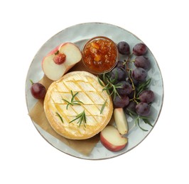 Tasty baked brie cheese with rosemary, fruits and jam isolated on white, top view