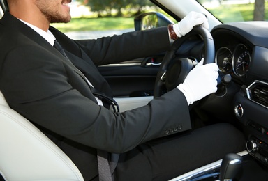 Photo of Young driver in luxury car. Chauffeur service
