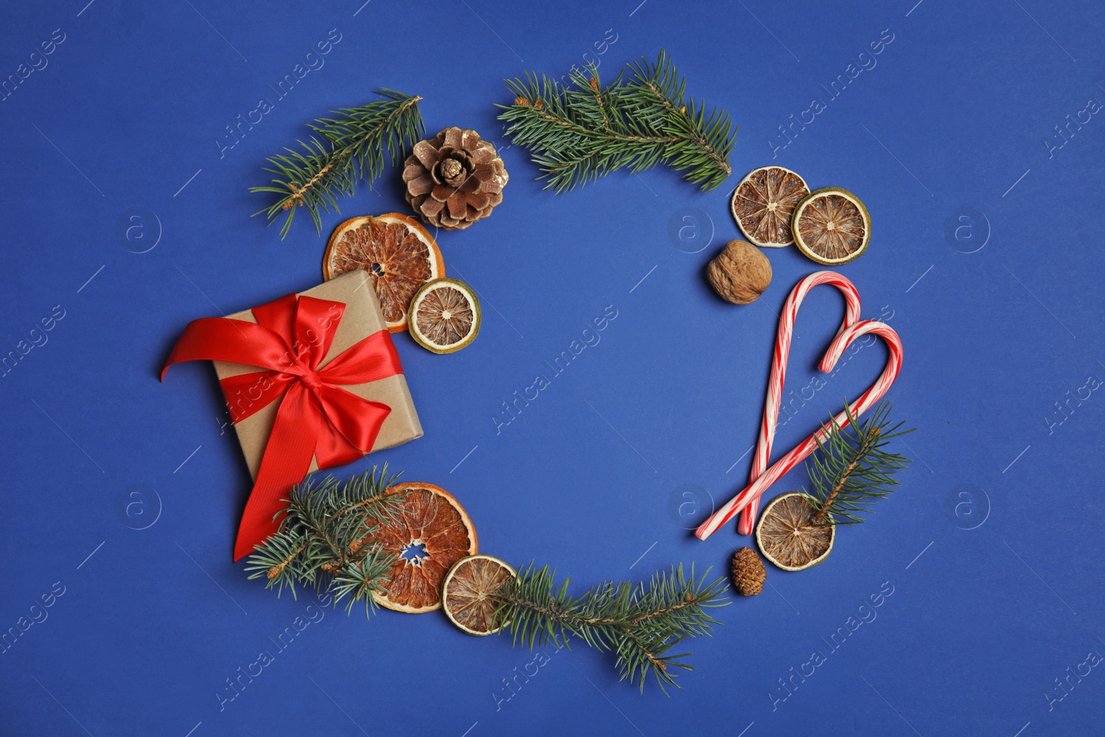 Photo of Flat lay composition with Christmas decor and space for text on color background. Festive winter design