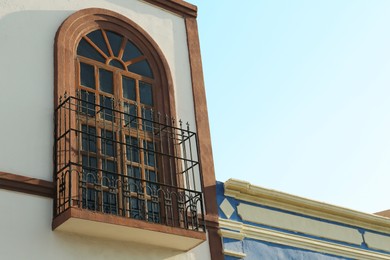 Exterior of building with beautiful window and balcony