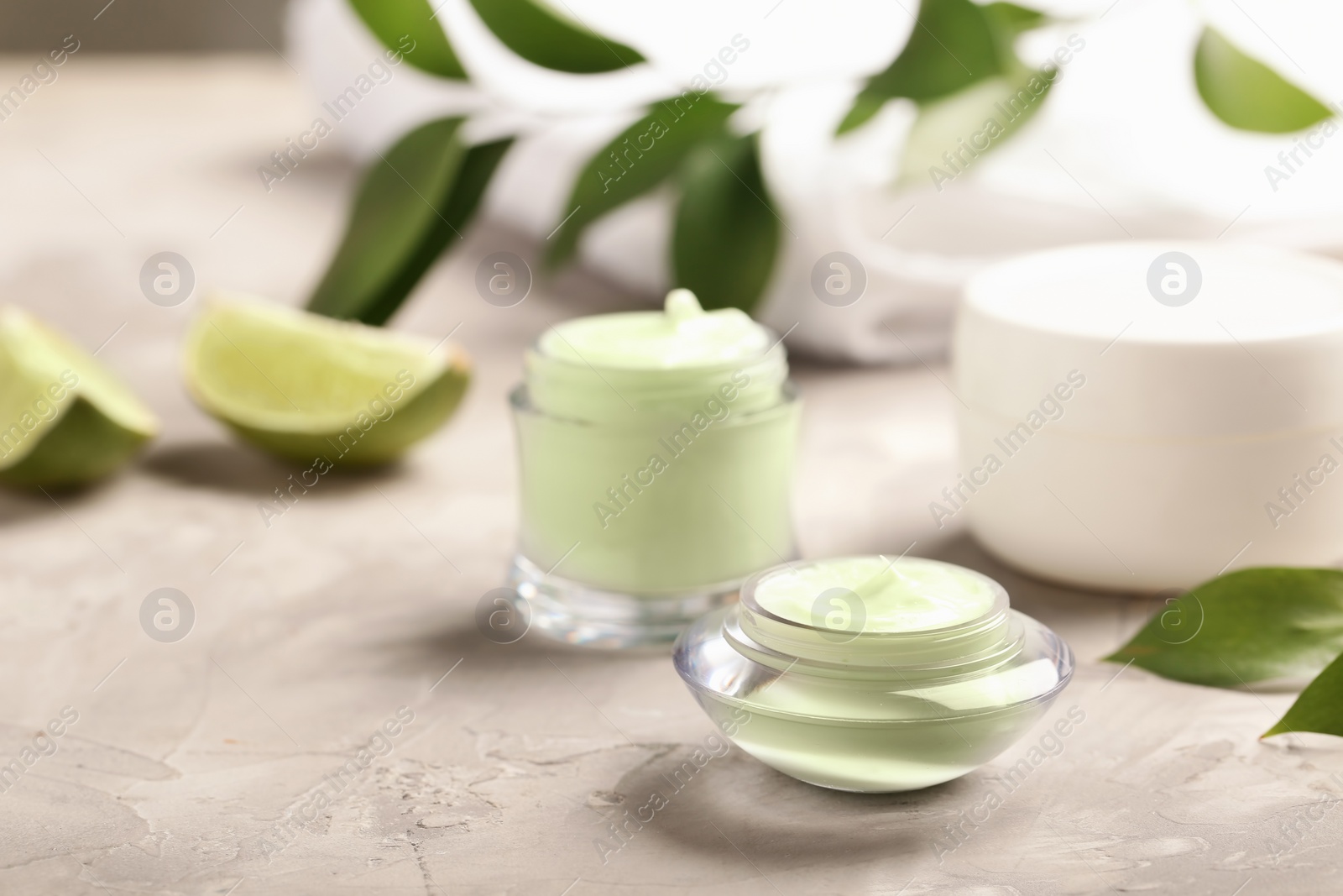 Photo of Hand cream jars on table. Natural cosmetic