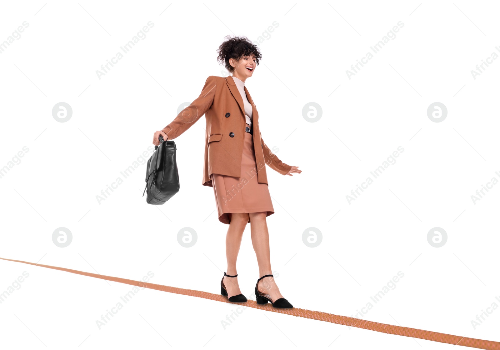 Image of Businesswoman walking rope against white background. Risk or balance concept