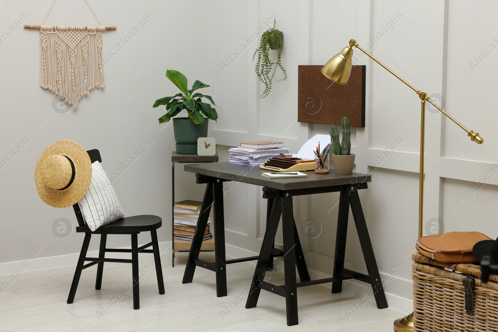 Photo of Writer's workplace with typewriter on dark table desk in room