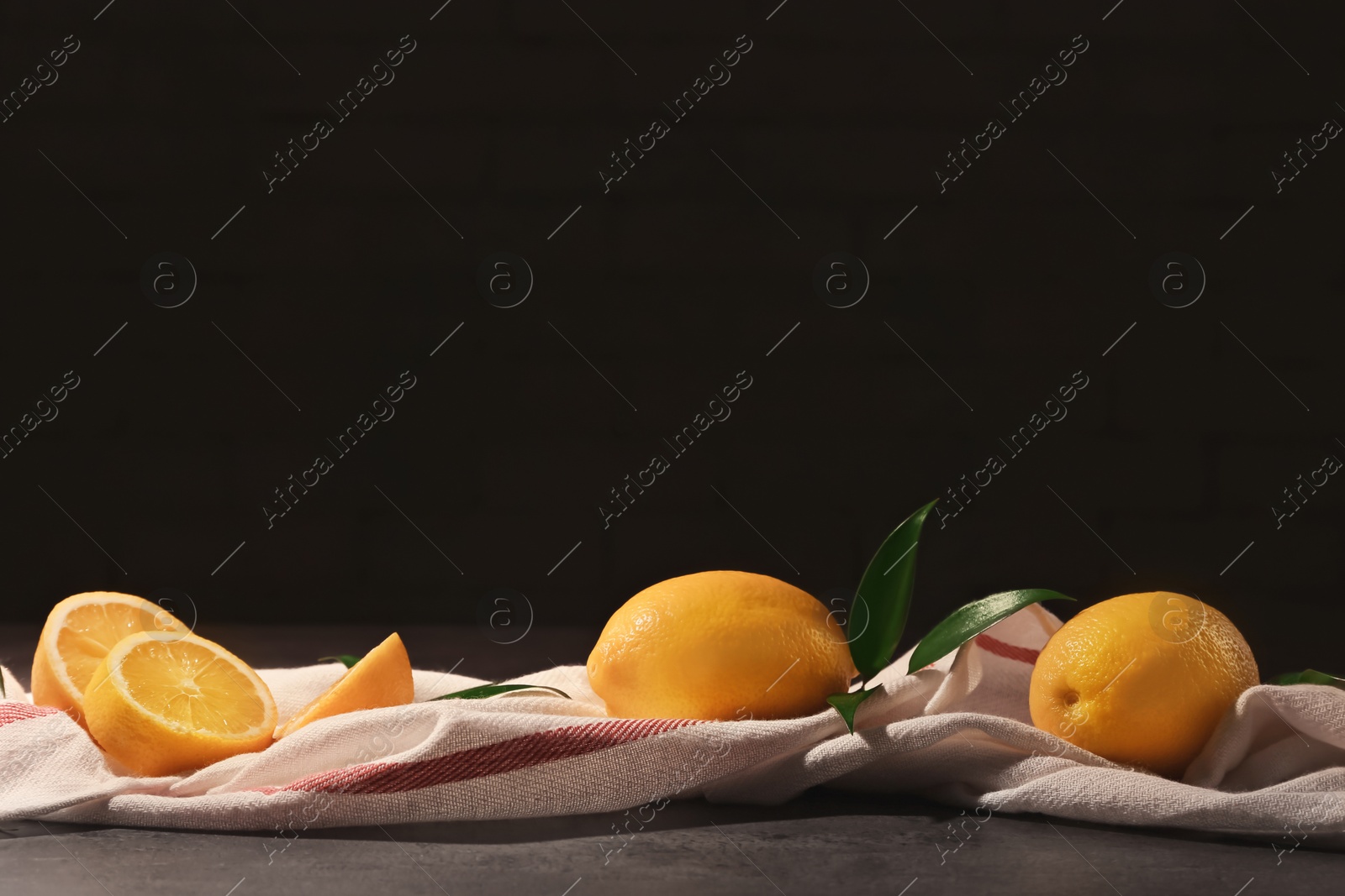 Photo of Fresh juicy lemons on table