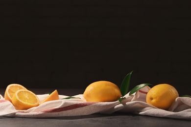 Photo of Fresh juicy lemons on table