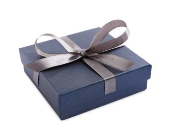 Photo of Blue gift box with satin bow on white background