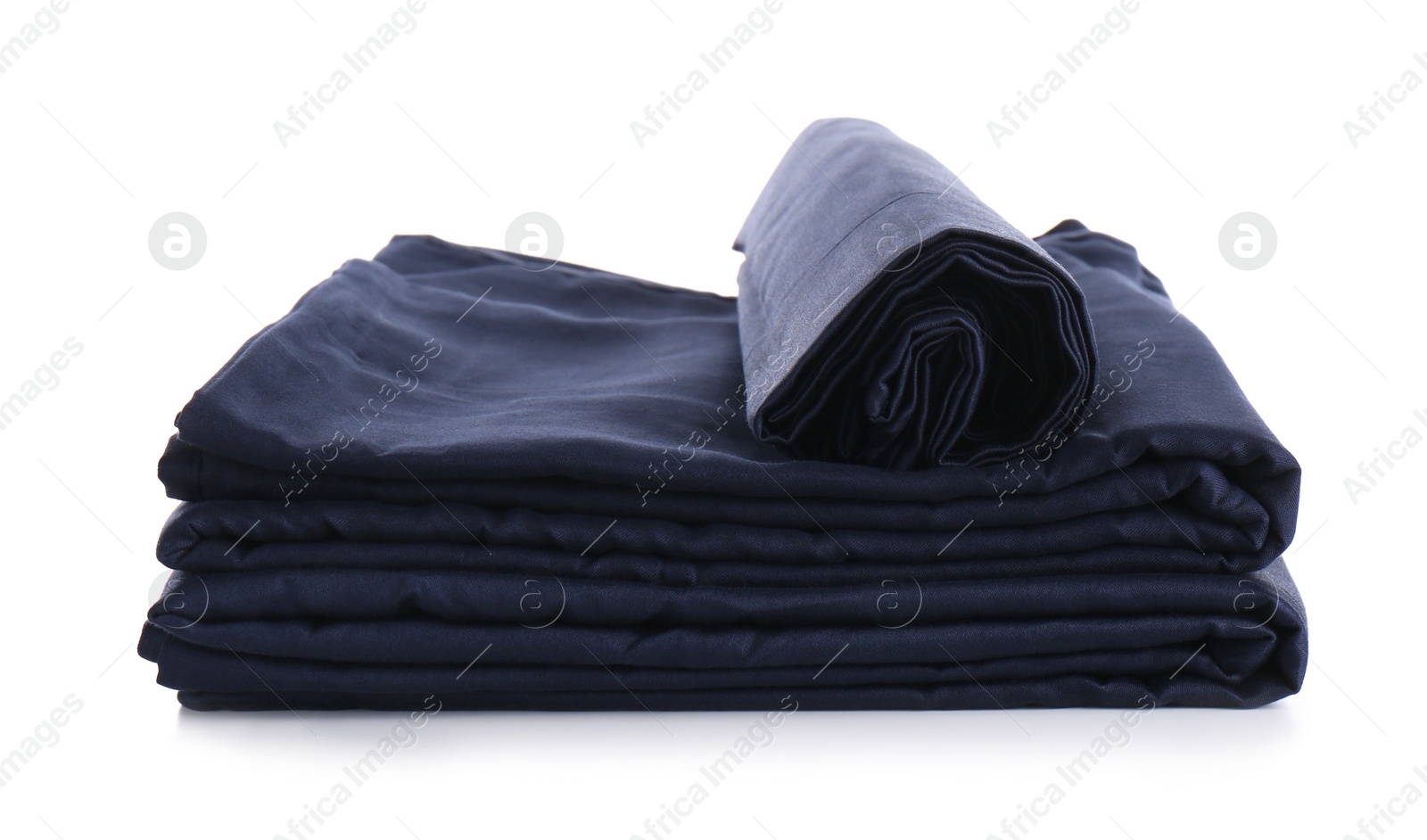 Photo of Stack of clean silky bed linen isolated on white