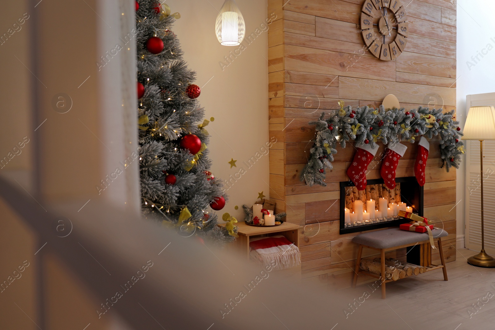 Photo of Stylish room interior with decorative fireplace. Christmas time