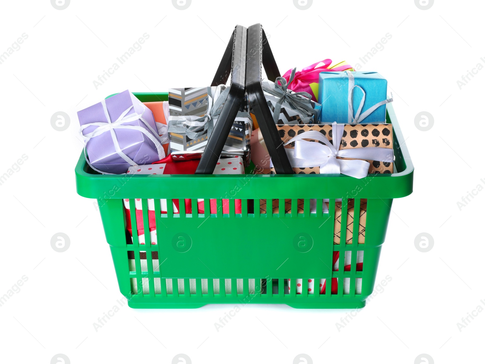 Photo of Green shopping basket with different gifts on white background