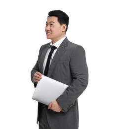 Businessman in suit with laptop posing on white background