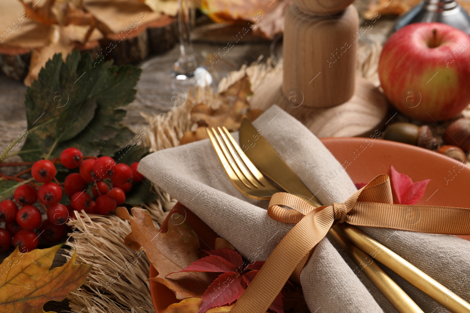 Photo of Festive table setting with autumn decor on desk, closeup