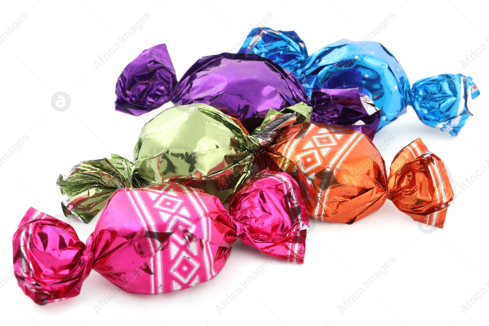 Photo of Sweet candies in colorful wrappers on white background