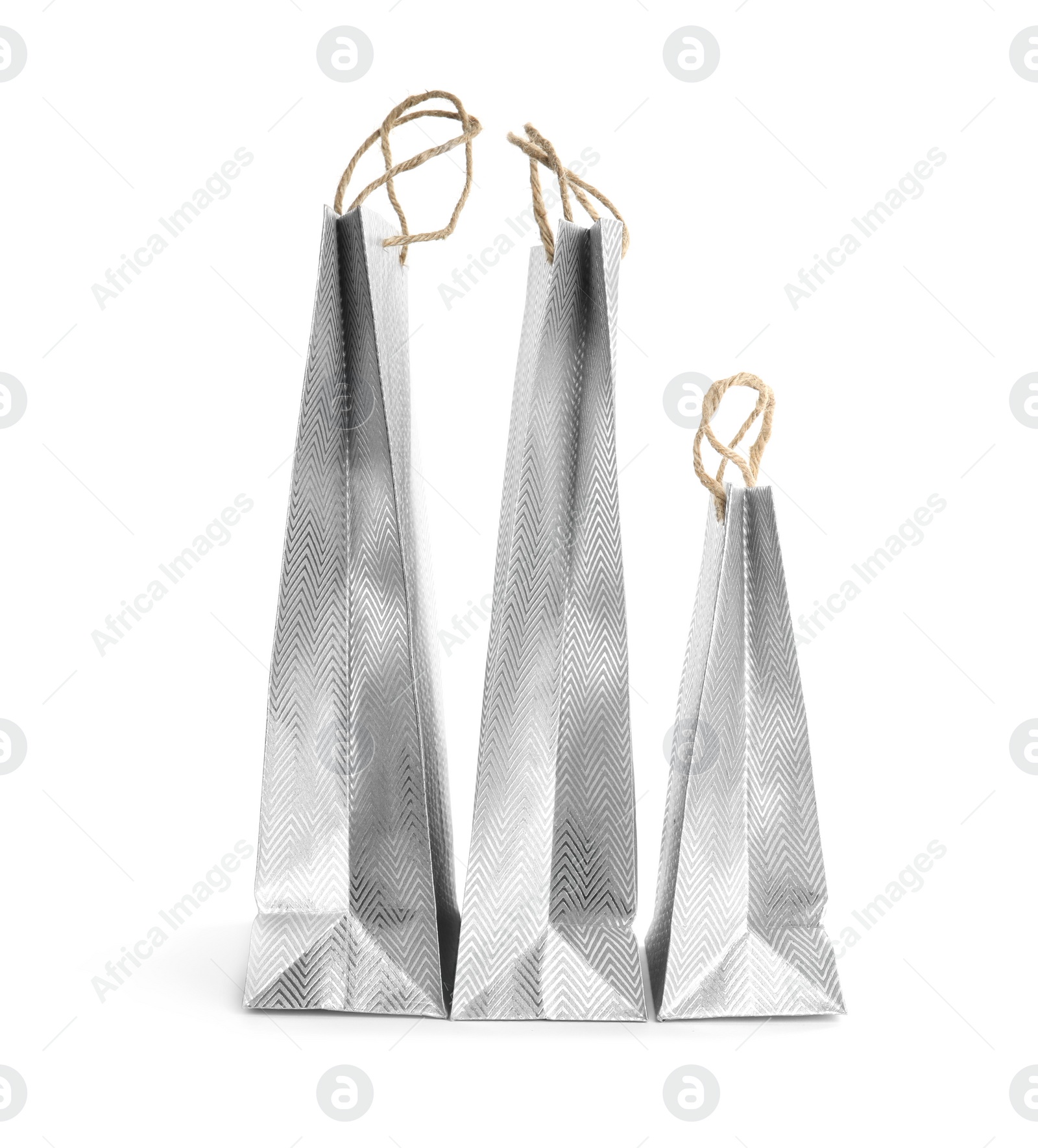 Photo of Silver paper shopping bags isolated on white