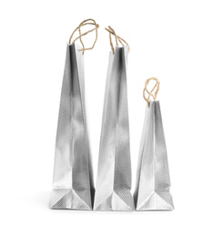 Photo of Silver paper shopping bags isolated on white