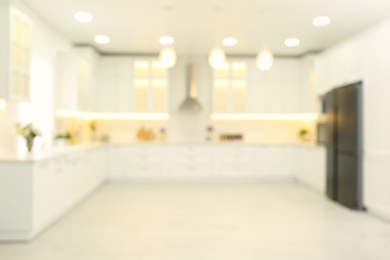 Photo of Blurred view of modern kitchen interior with stylish furniture