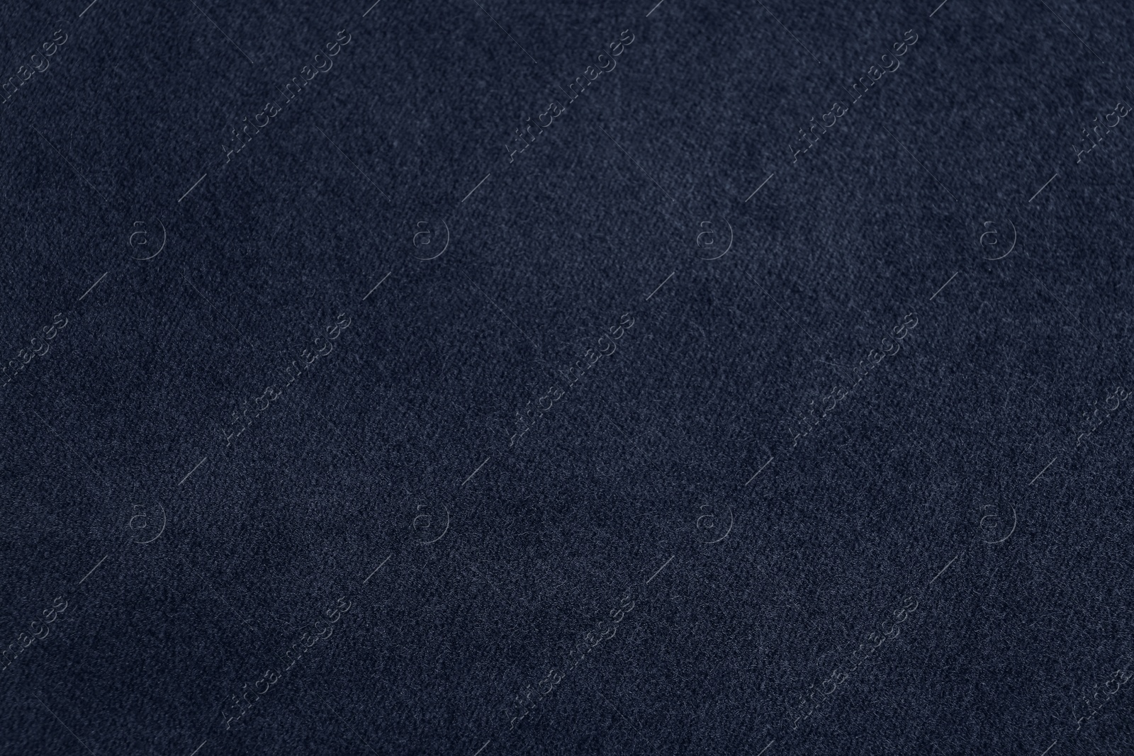 Photo of Texture of dark blue fabric as background, closeup