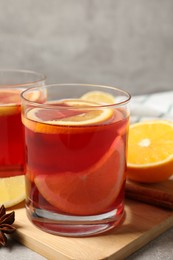 Photo of Aromatic punch drink and ingredients on table