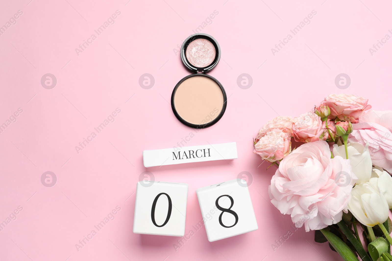 Photo of International Women's day - 8th of March. Cosmetic products, wooden block calendar and beautiful flowers on pink background, flat lay