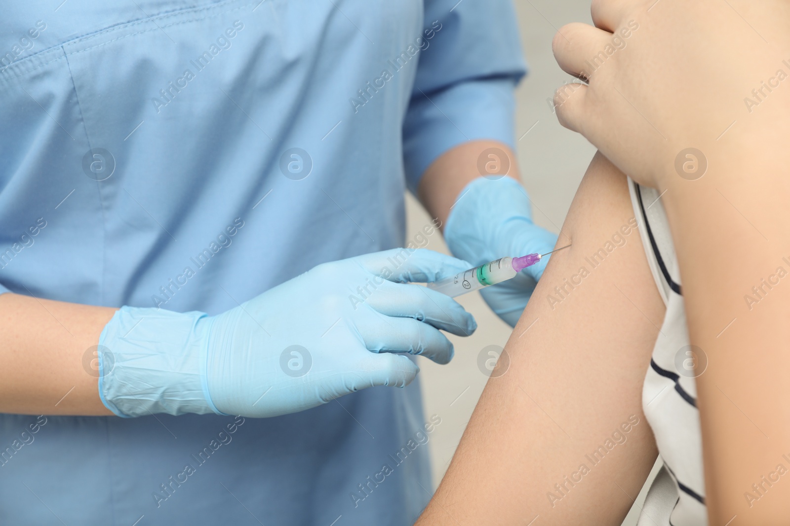 Photo of Doctor giving hepatitis vaccine to patient on grey background, closeup