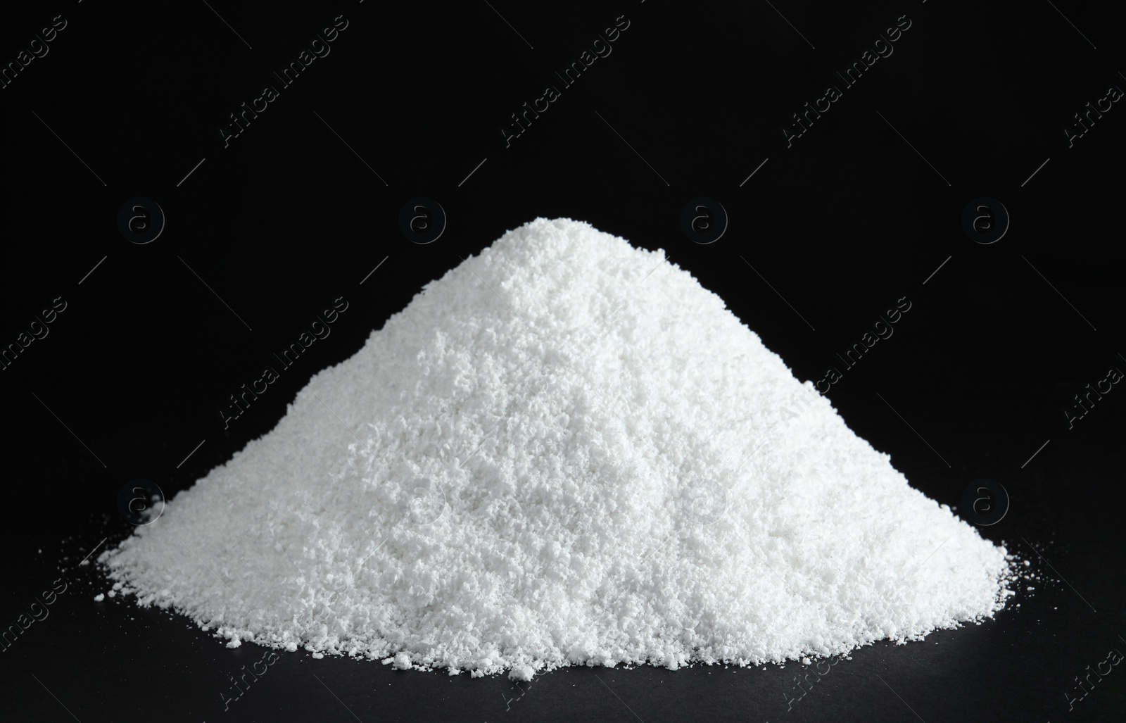 Photo of Heap of white snow on black background