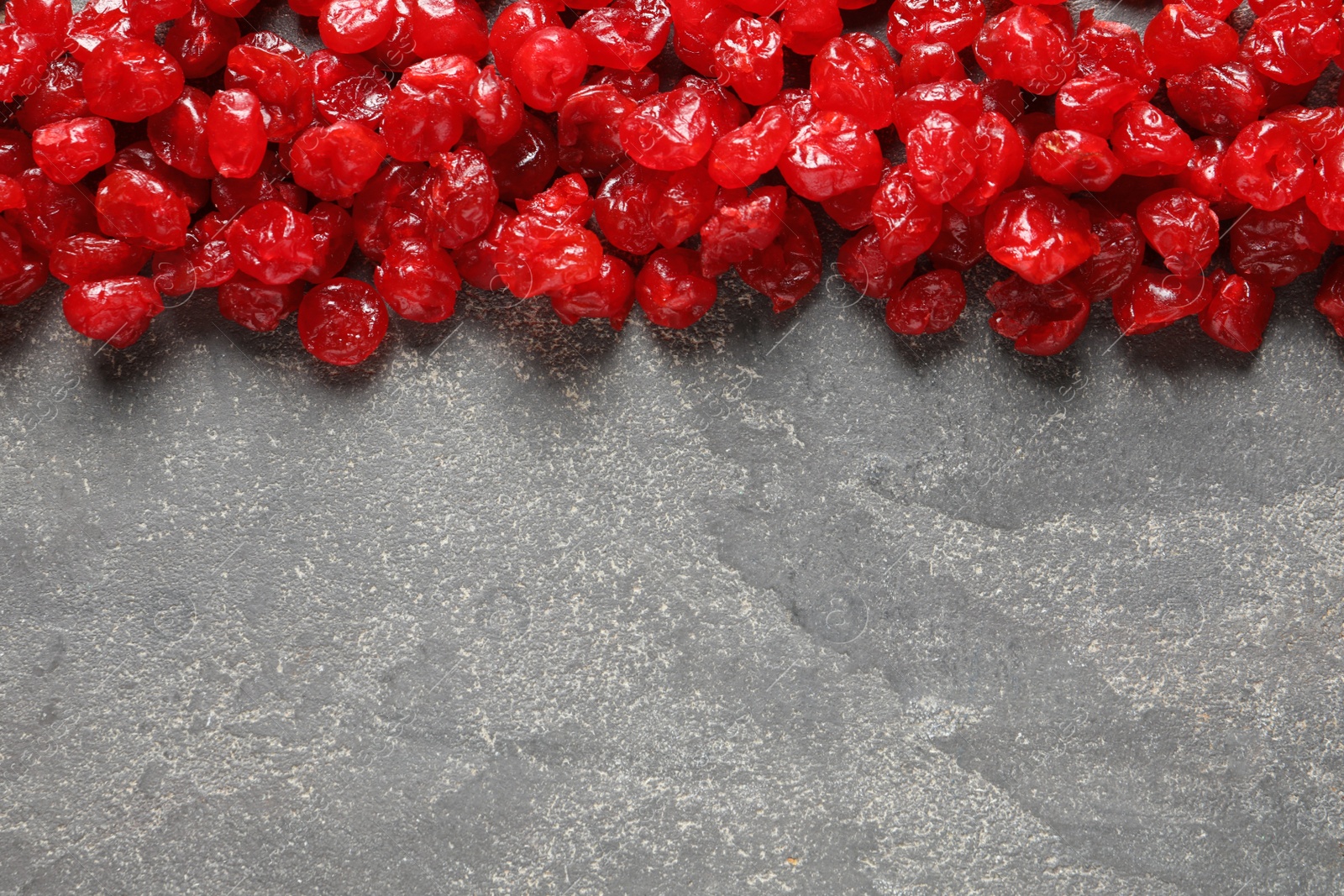 Photo of Cherries on color background, top view with space for text. Dried fruit as healthy snack