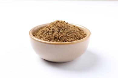 Photo of Bowl of aromatic caraway (Persian cumin) powder isolated on white