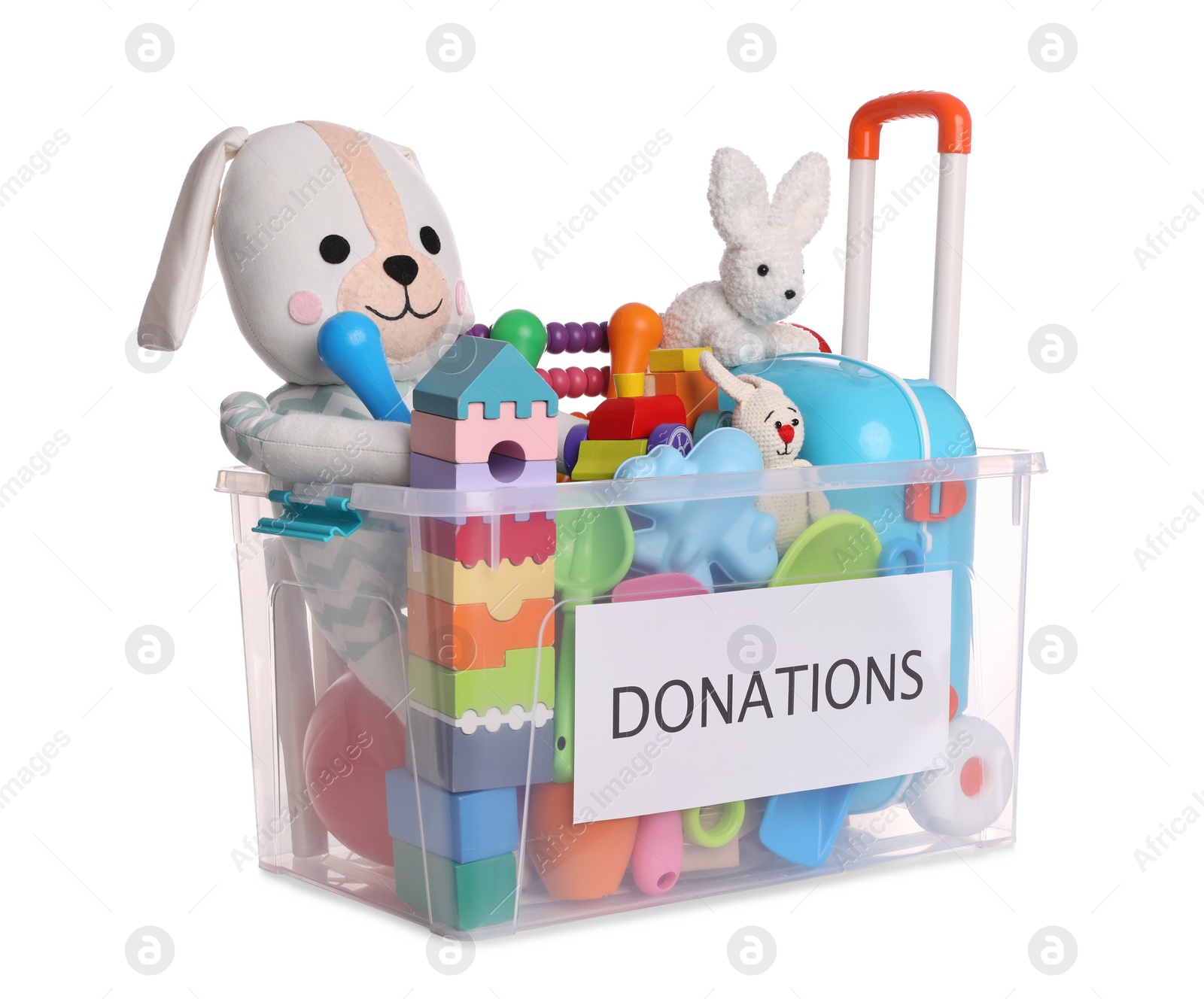 Photo of Donation box full of different toys isolated on white