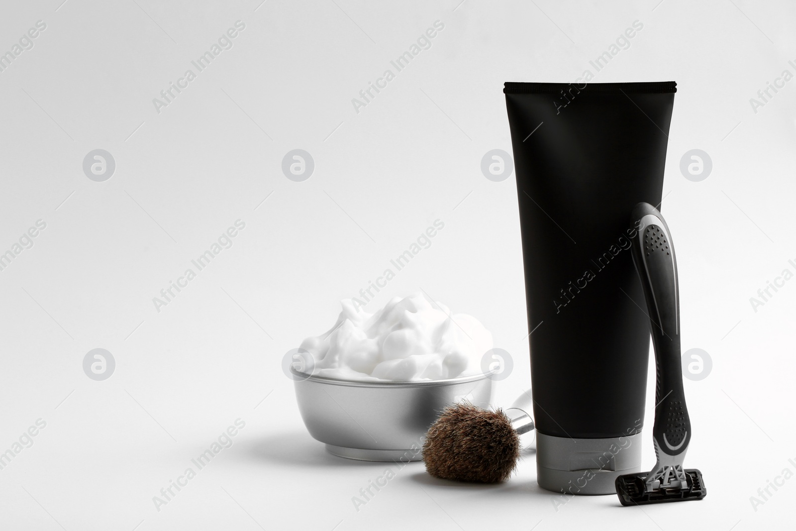 Photo of Set of shaving equipment and men's cosmetic products on light background. Space for design