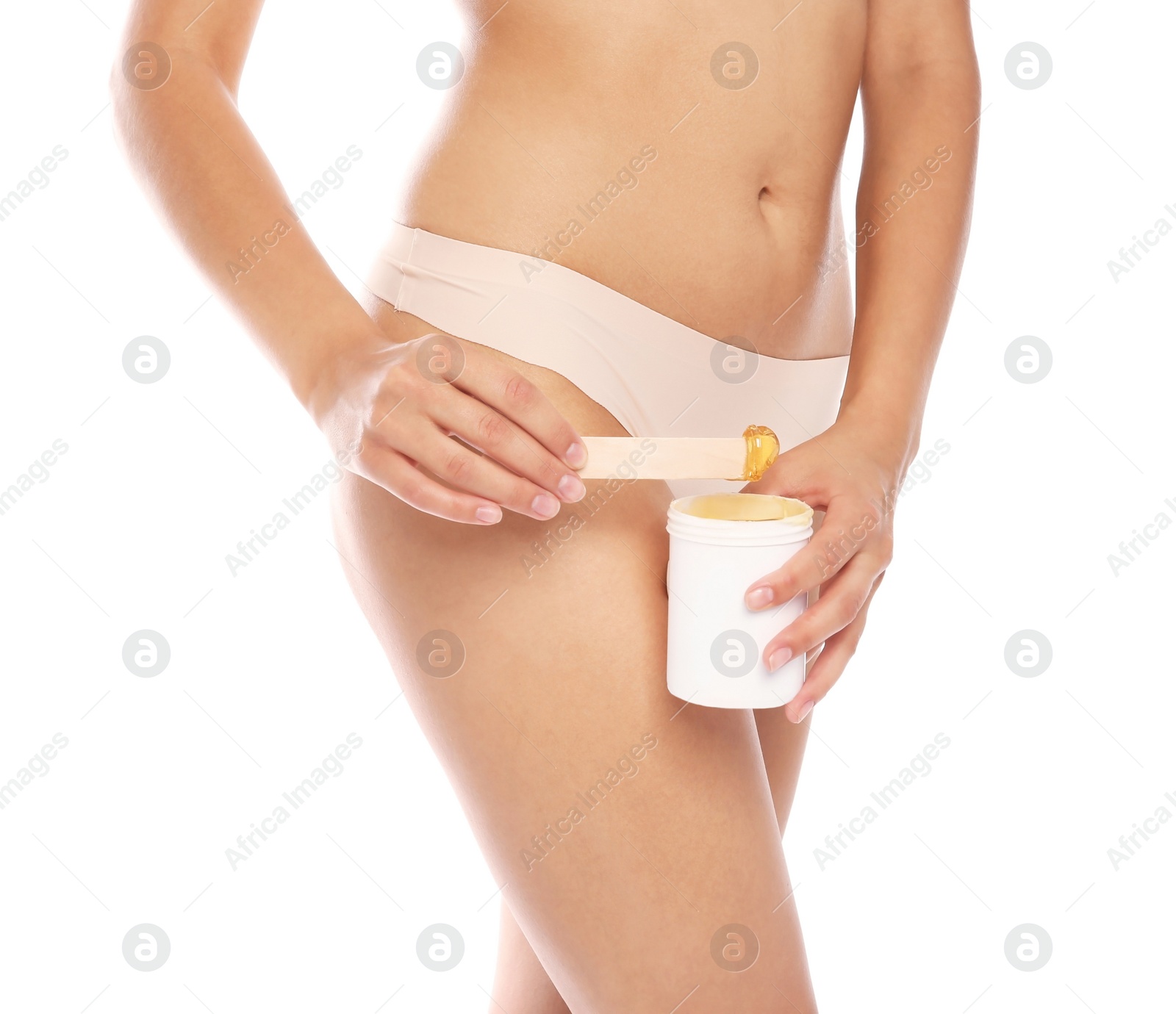 Photo of Young woman waxing bikini area on white background