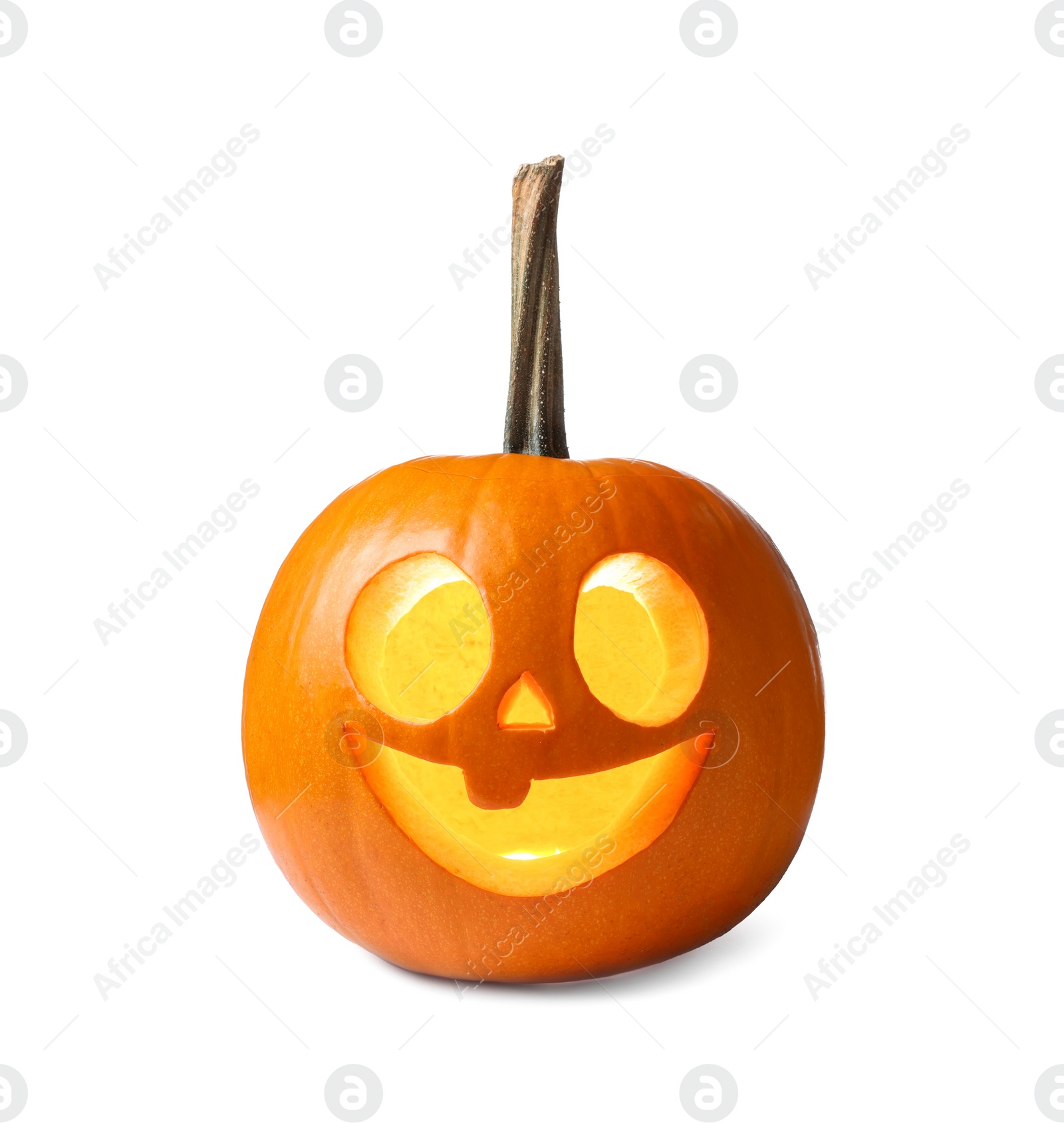 Photo of Carved pumpkin for Halloween lit from within by candle isolated on white