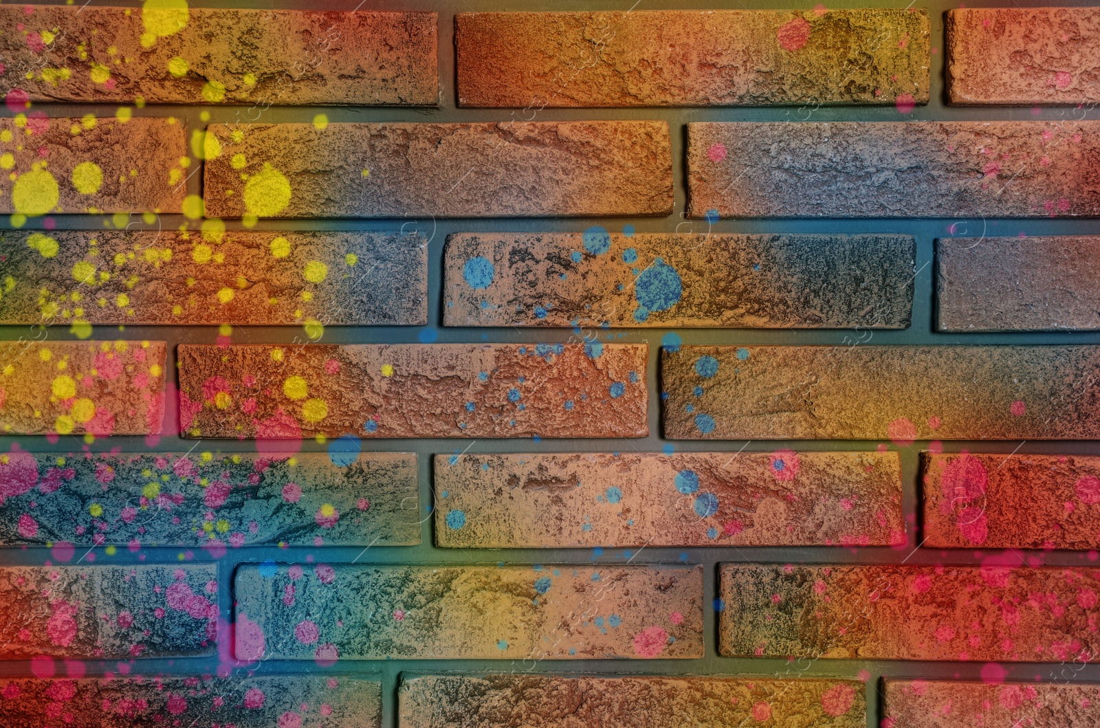 Image of Abstract colorful graffiti drawn on brick wall