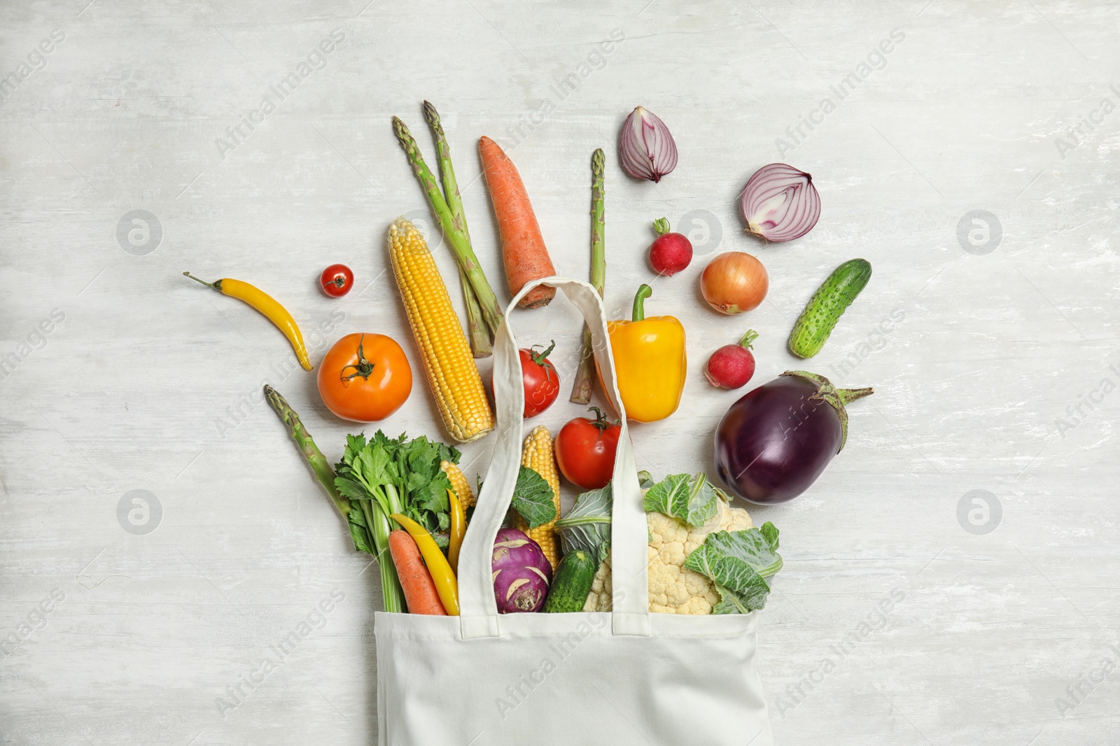 Photo of Flat lay composition with fresh vegetables on light background