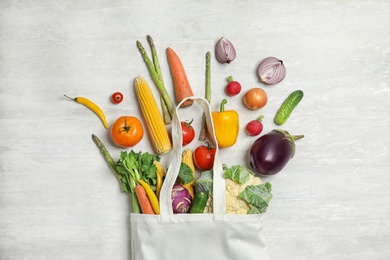 Flat lay composition with fresh vegetables on light background