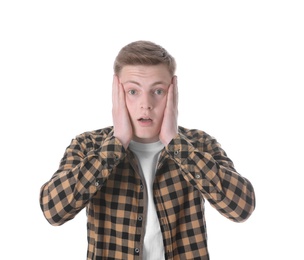 Portrait of shocked teenage boy on white background